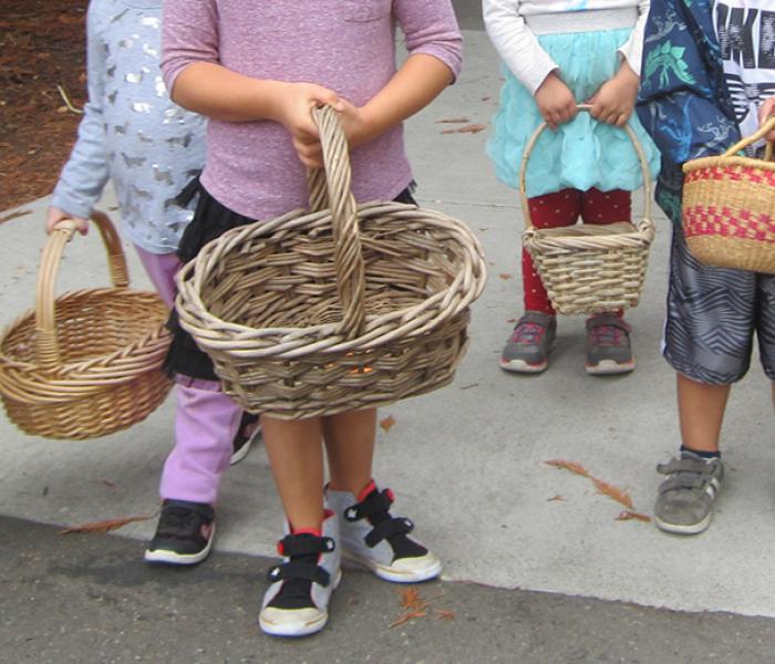Children holding baskets