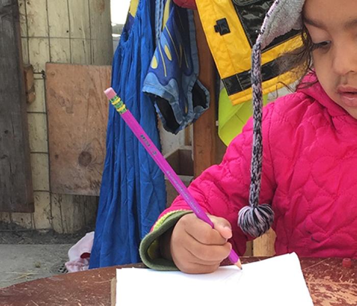 Young girl writing