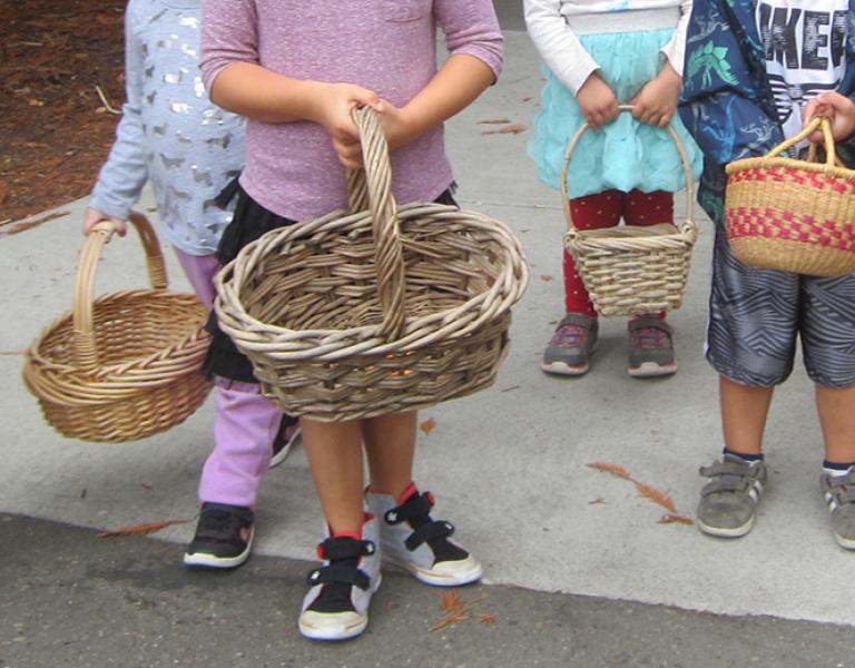 Children holding baskets
