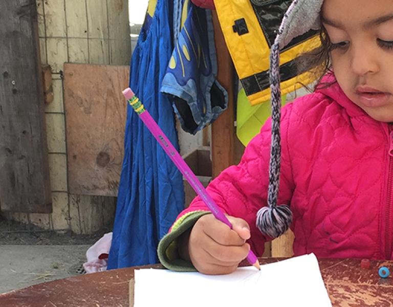 Young girl writing