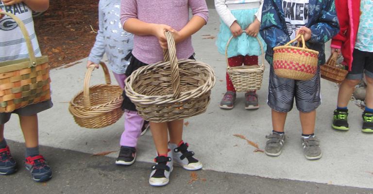 Children holding baskets