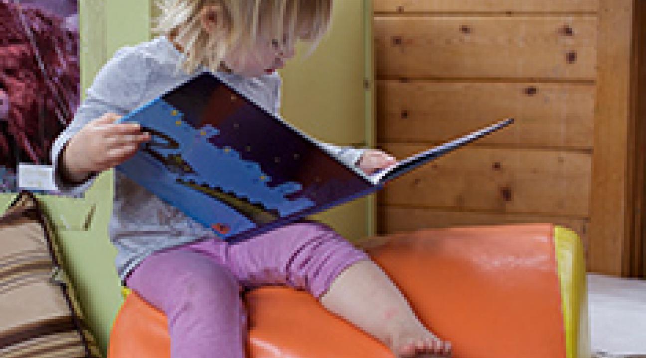 Child reading a book