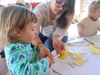 Student observer participant working with child. 